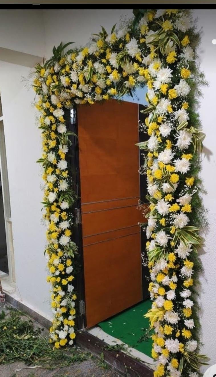 Marigold and chrysanthemum doorway decoration for housewarming
