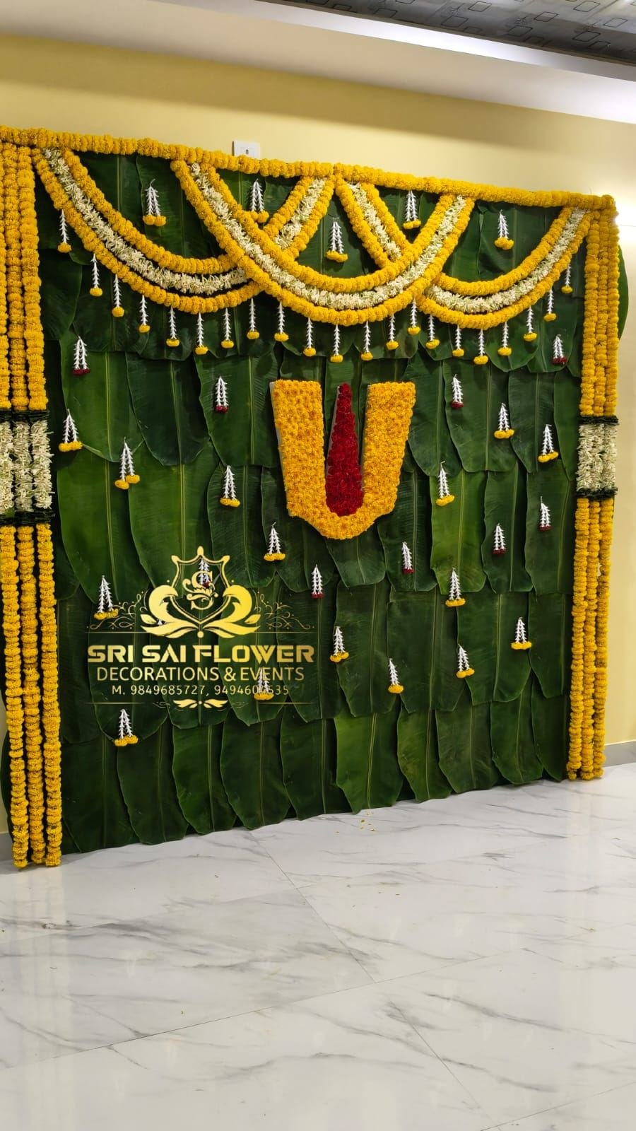 Traditional maroon and gold wedding mandap decorated by Sri Sai Flower Decorations, Hyderabad